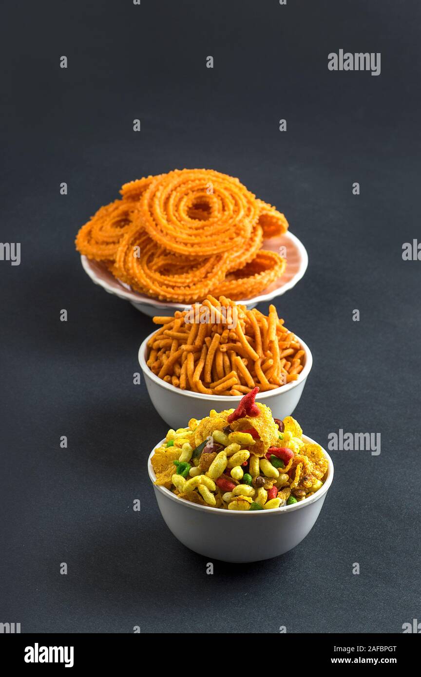Indian Snack : Chakli, chakali or Murukku and Besan (Gram flour) Sev and chivada or chiwada. Diwali Food Stock Photo
