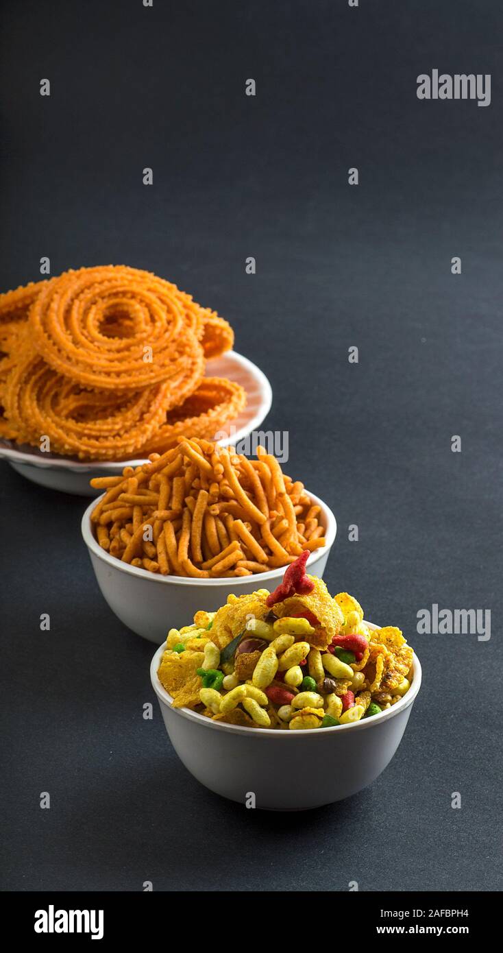 Indian Snack : Chakli, chakali or Murukku and Besan (Gram flour) Sev and chivada or chiwada. Diwali Food Stock Photo