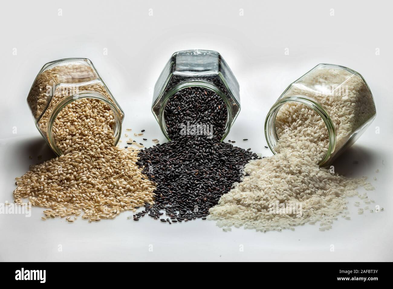 glass jars with three types of rice Stock Photo