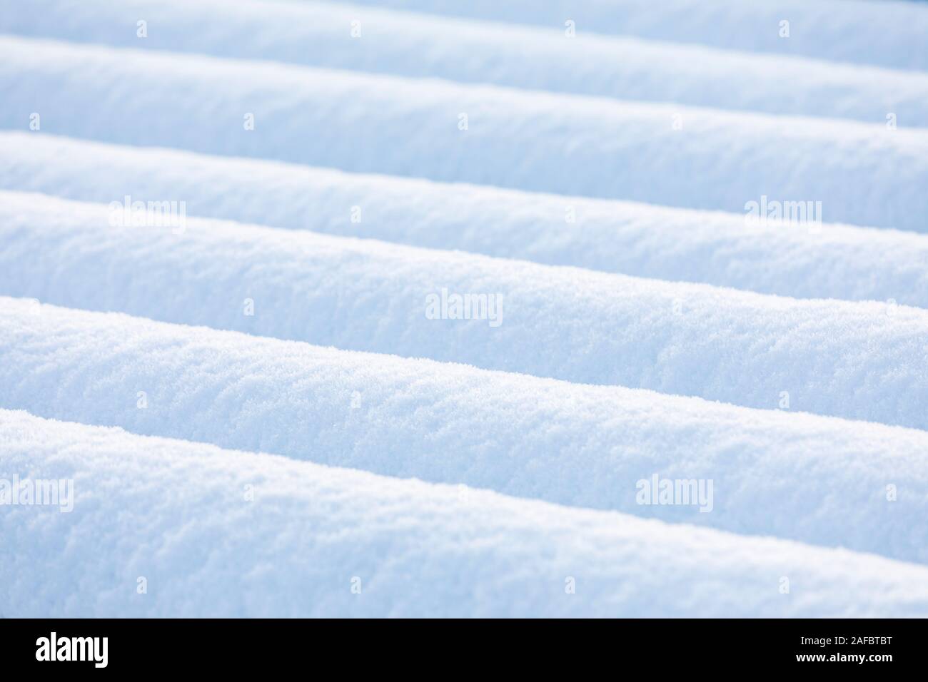 Closeup of lines of pure white snow piles at winter Stock Photo
