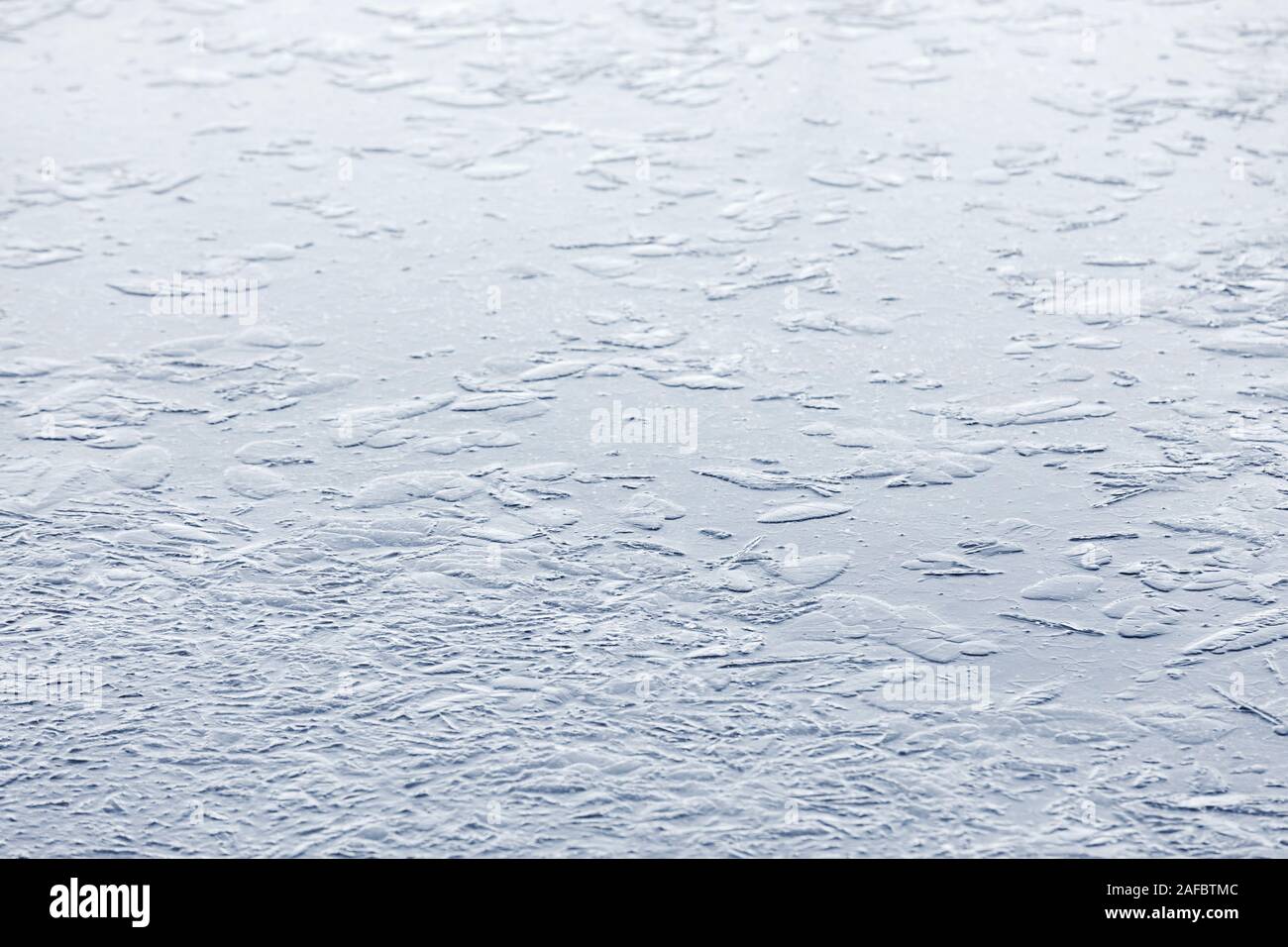 Abstract background of naturally textured frozen water surface Stock Photo
