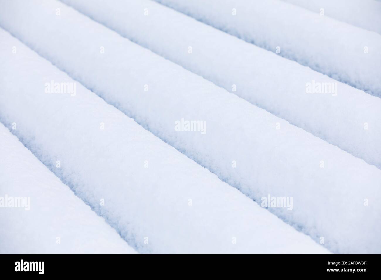 Closeup of lines of pure white snow piles at winter Stock Photo