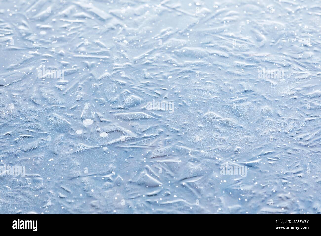 Abstract background of naturally textured frozen water surface Stock Photo