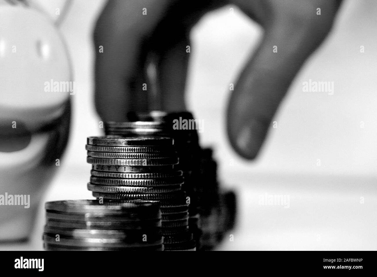 Piggy bank with stack of coin on white Stock Photo - Alamy