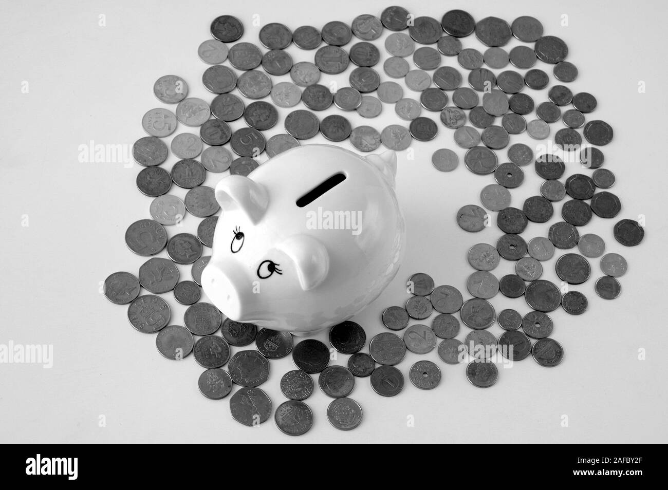 Piggy bank with stack of coin on white Stock Photo - Alamy