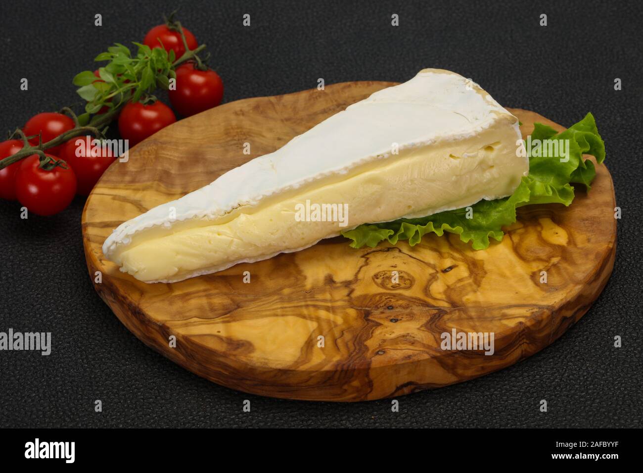 Brie cheese triangle served salad leaves Stock Photo Alamy