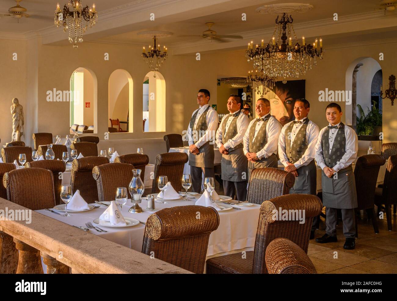 Iguana Restaurant wait staff ready for dinner guests at Casa Kimberly, Puerto Vallarta, Jalisco, Mexico. Stock Photo