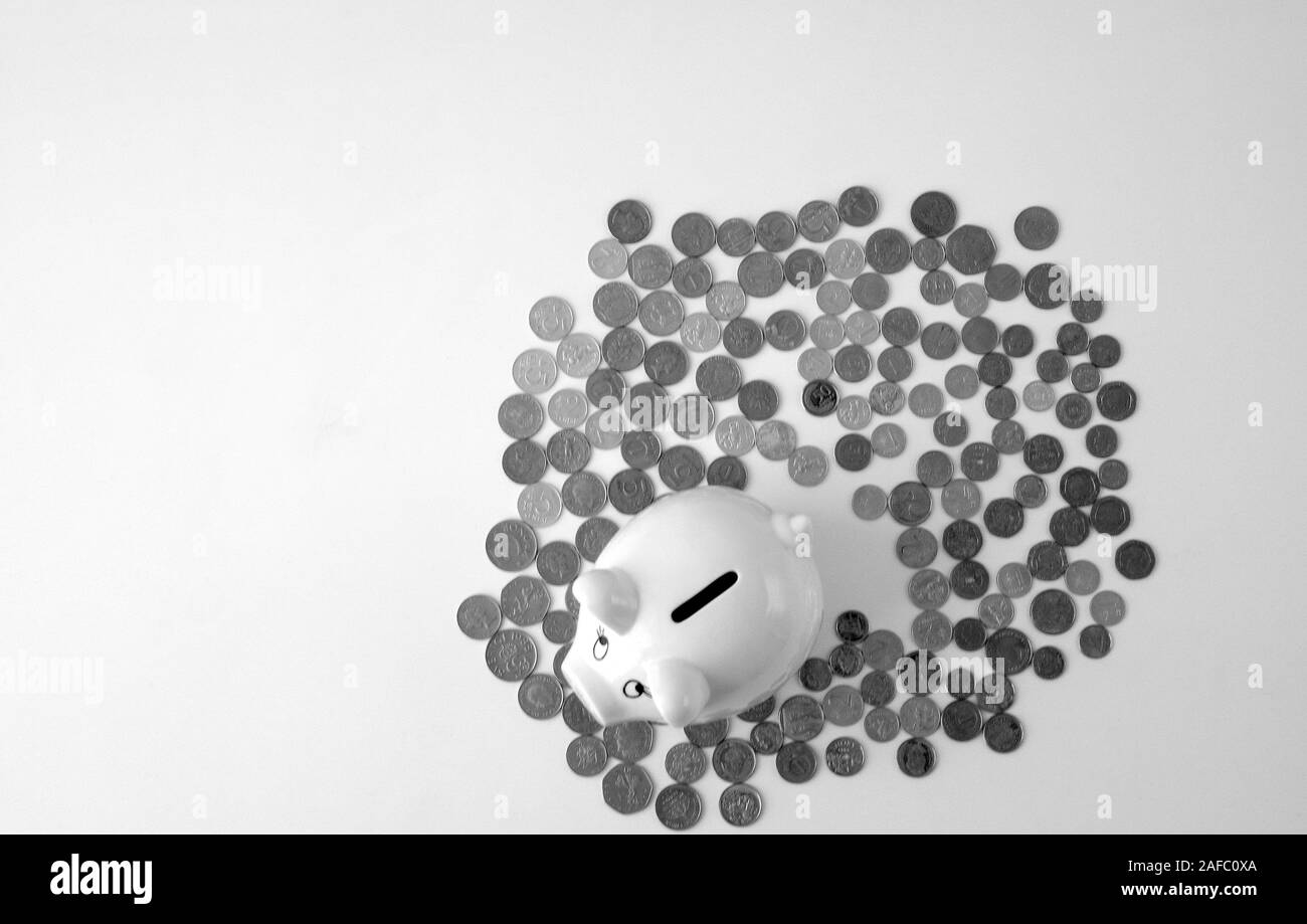 Piggy bank with stack of coin on white Stock Photo - Alamy