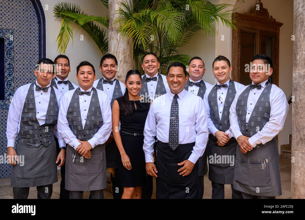 Restaurant Iguana Manager and Sommelier Raul Fernandez and his wait staff at Casa Kimberly, Puerto Vallarta, Jalisco, Mexico. Stock Photo