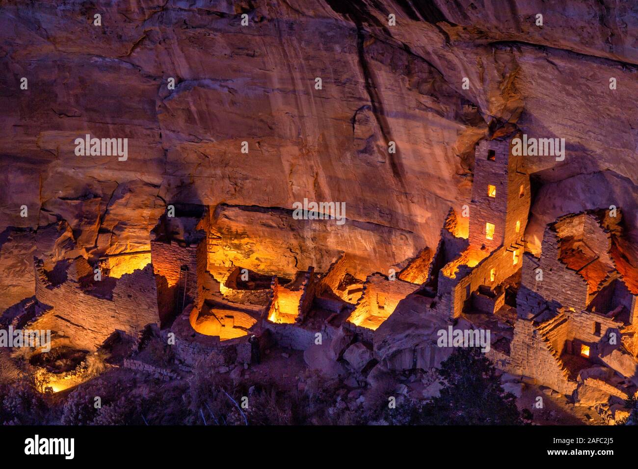 Square Tower House, the tallest cliff dwelling in Mesa Verde, illuminated for only the 2nd time during the Luminaria Festival in Mesa Verde National P Stock Photo