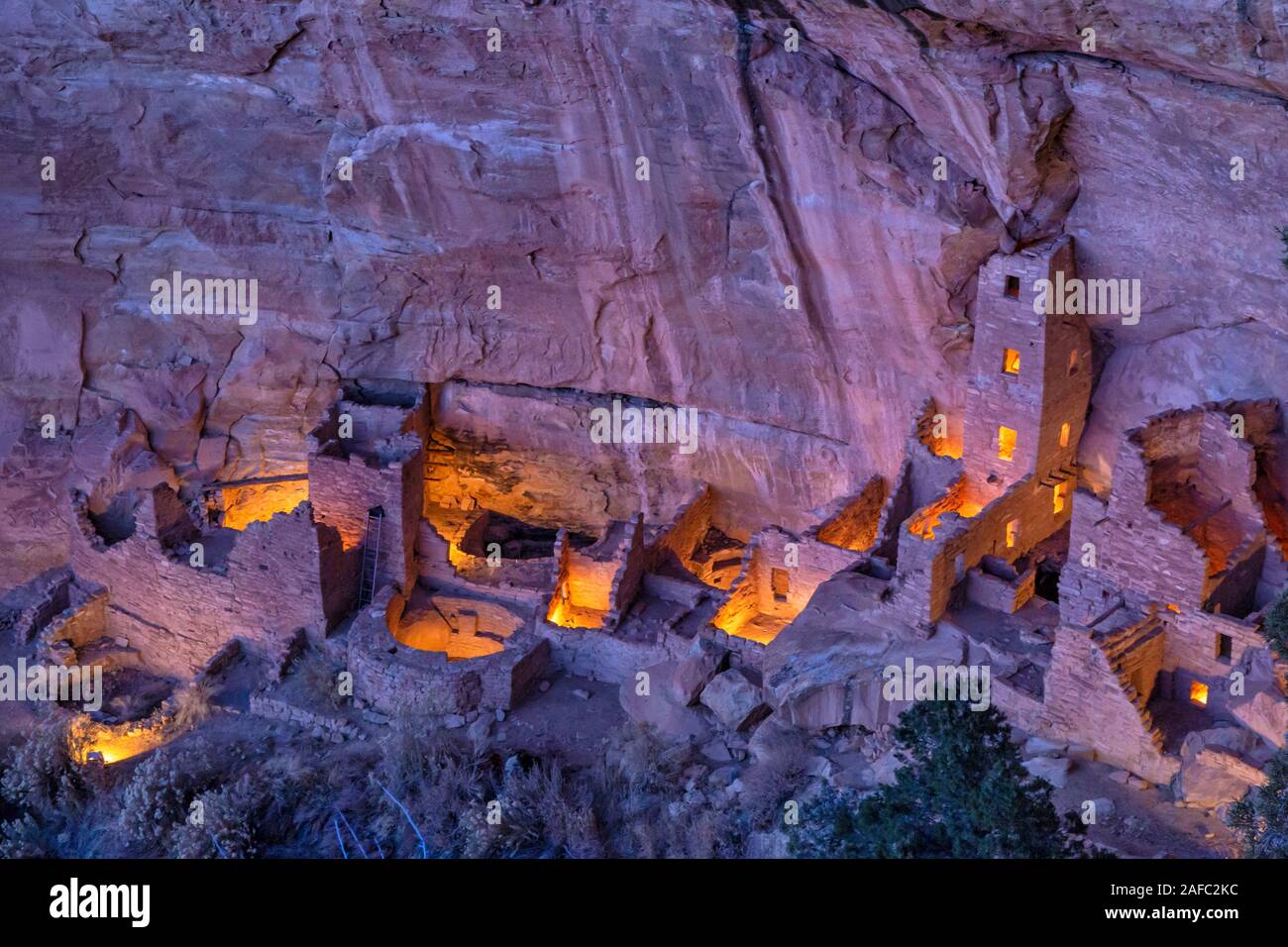 Square Tower House, the tallest cliff dwelling in Mesa Verde, illuminated for only the 2nd time during the Luminaria Festival in Mesa Verde National P Stock Photo