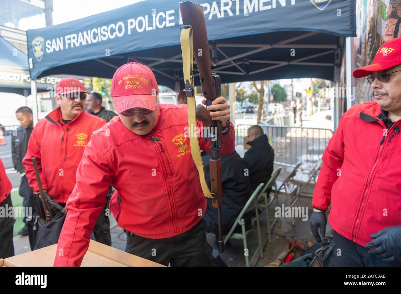 Police officers are checking a brand new Thompson submachine gun traded in by people during the annual gun buy-back event hosted by United Playaz in San Francisco, California, United States on December 14, 2019. Today marks the 7th anniversary of the Sandy Hook mass shooting. The Sandy Hook Elementary School shooting occurred on December 14, 2012, in Newtown, Connecticut, United States, when 20-year-old Adam Lanza shot and killed 26 people, including 20 children between six and seven years old, and six adult staff members with an AR-15 style rifle and a Glock pistol. (Photo by Yichuan Cao/Sipa Stock Photo