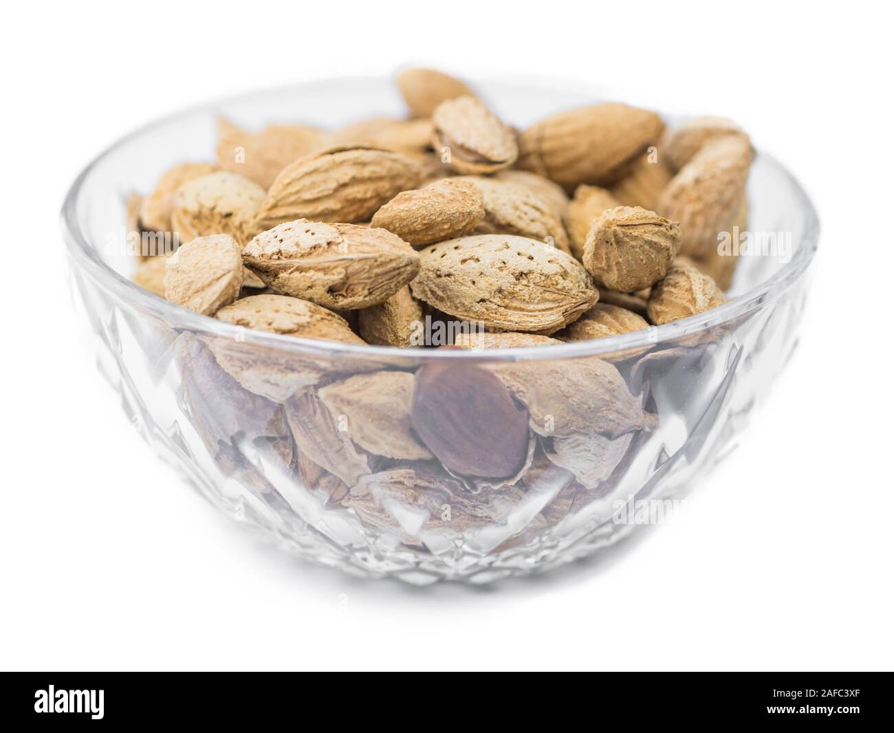 Roasted and salted Almonds (in the shell) isolated on white background