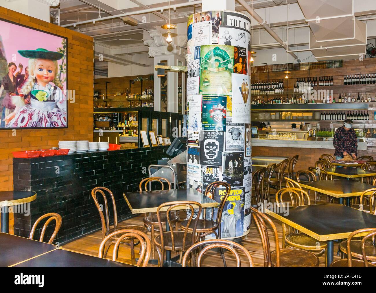 Melbourne, Australia - December 17, 2009: Cookie Thai eatery and beer hall. Cylindrical board around pillar displays posters for events and other mess Stock Photo