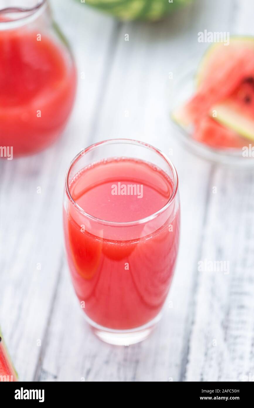 Watermelon Smoothie on rustic wooden background (close-up shot) Stock Photo