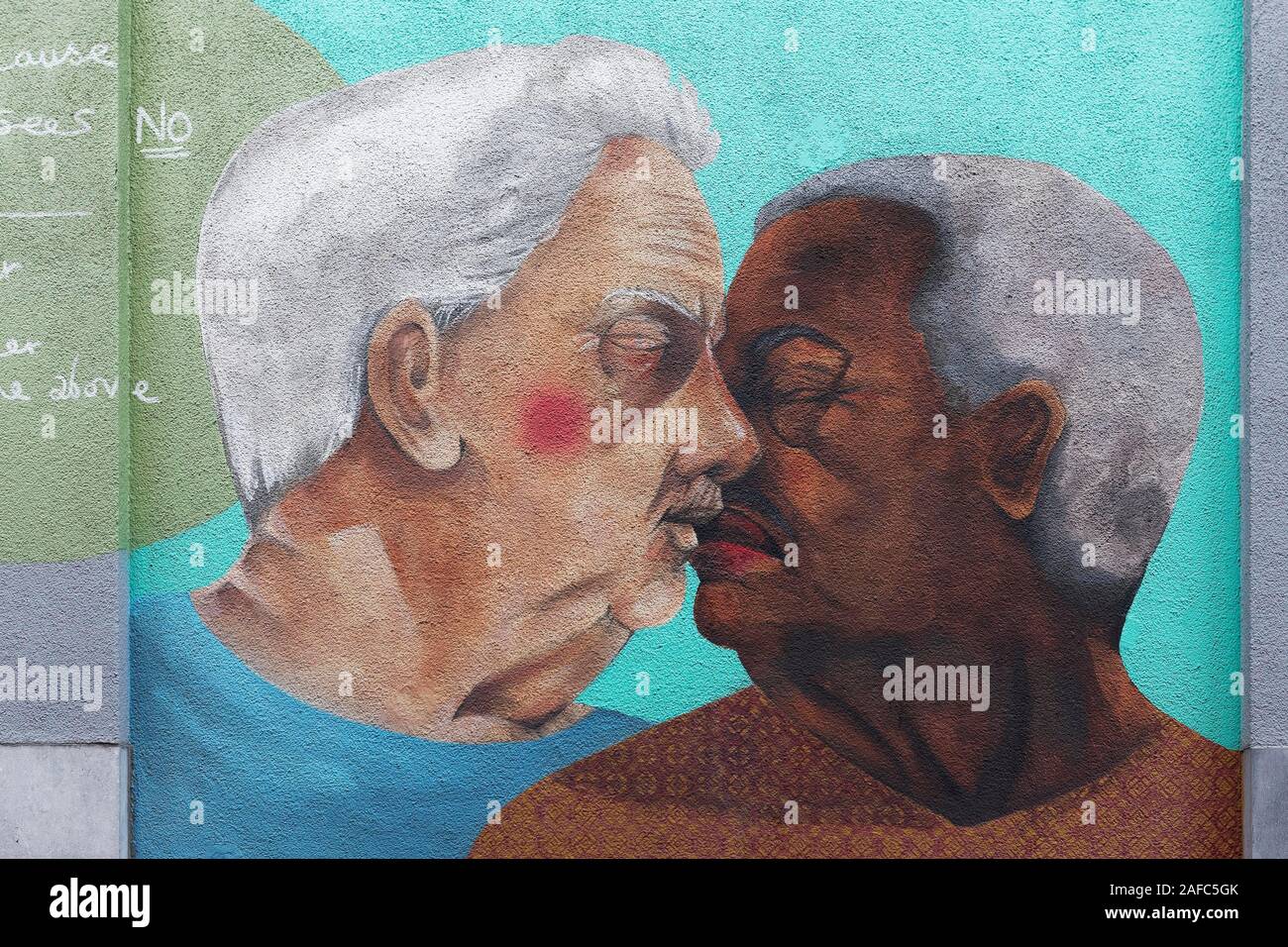 Two older gays kiss, one white, one colored, LGBT portrait, mural by Fotini Tikkou at Rainbow House, Rue de la Chaufferette, Lollepotstraat Stock Photo