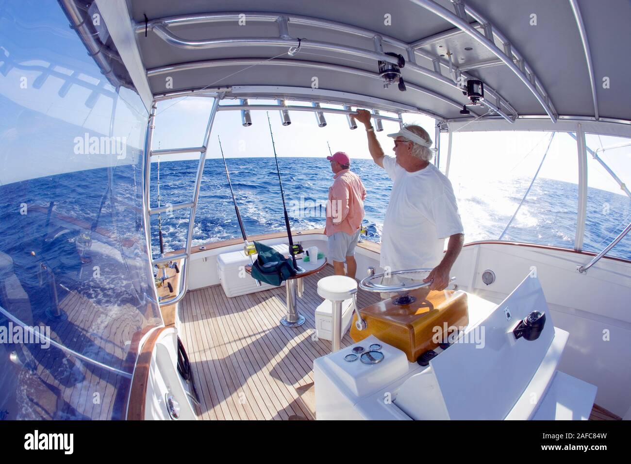 Men fishing off the coast of Key West, Florida, USA. Model Released. Stock Photo