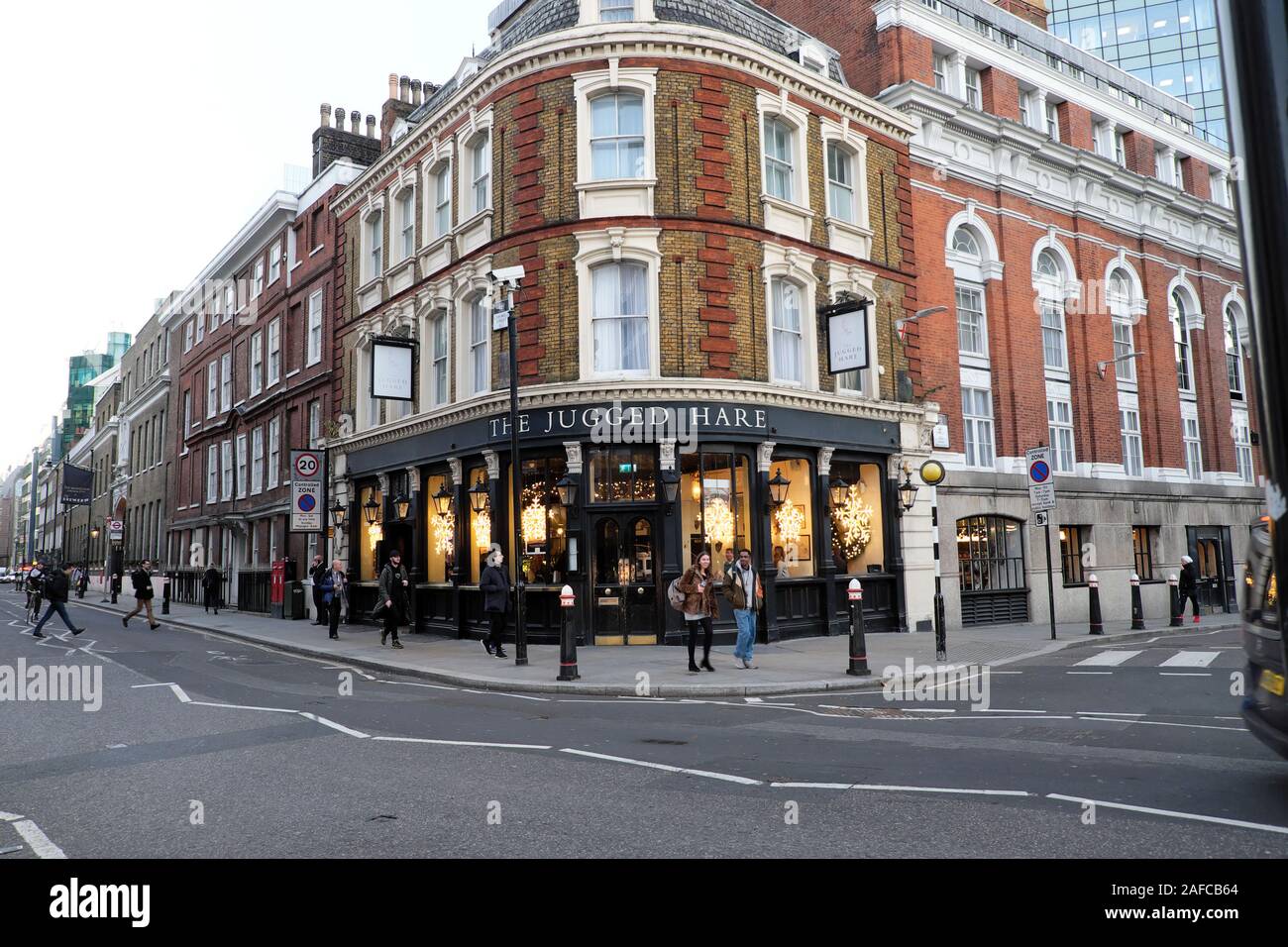 Outside view of The Jugged Hare pub near the Barbican Centre on corner of Silk Street and Chiswell Street at Christmas City of London UK  KATHY DEWITT Stock Photo