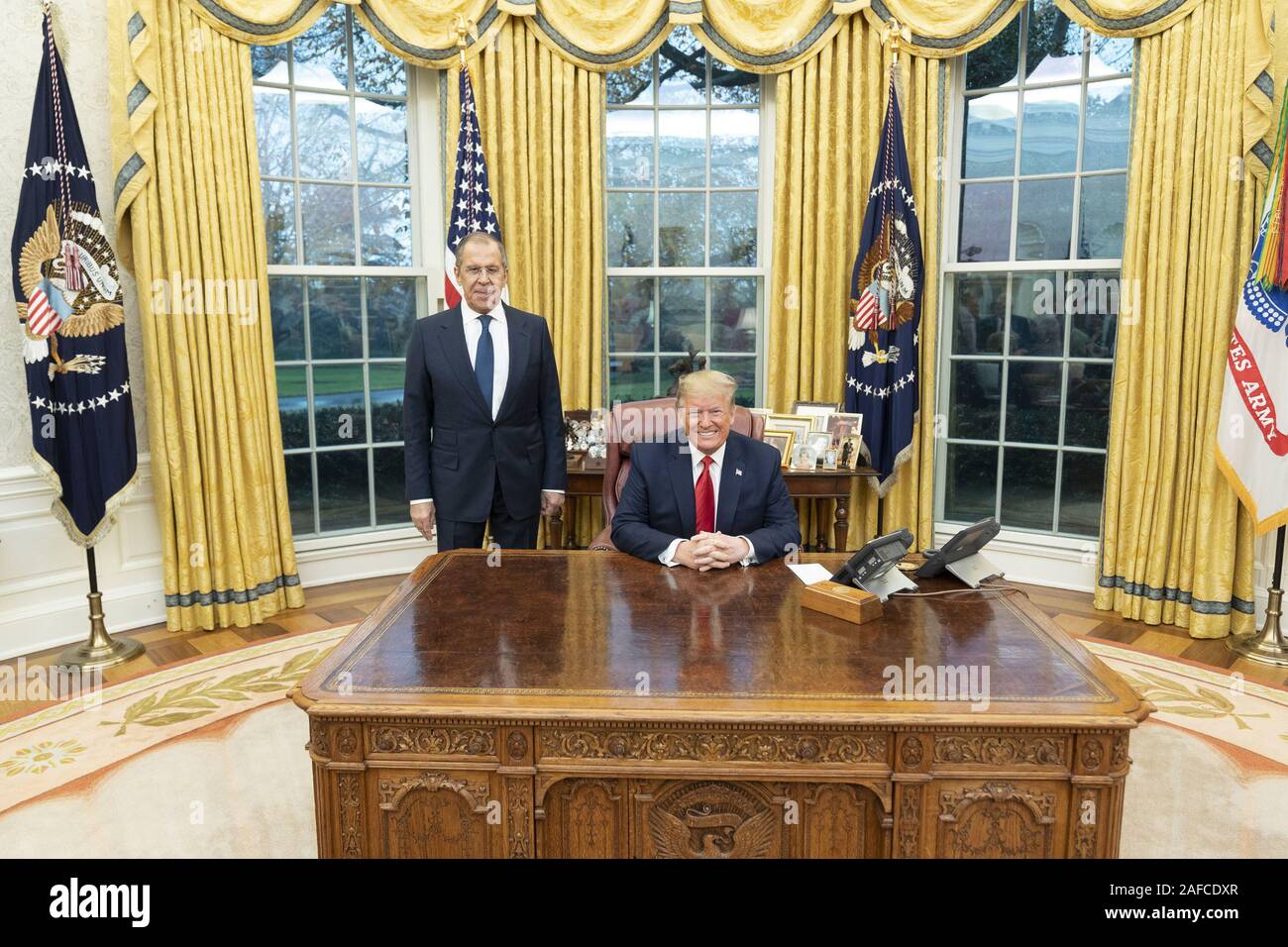 Washington, United States Of America. 10th Dec, 2019. President Donald J. Trump poses for a photo with Russian Foreign Minister Sergey Lavrov Tuesday, Dec. 10, 2019, in the Oval Office of the White House. People: President Donald J. Trump, Russian Foreign Minister Sergey Lavrov Credit: Storms Media Group/Alamy Live News Stock Photo