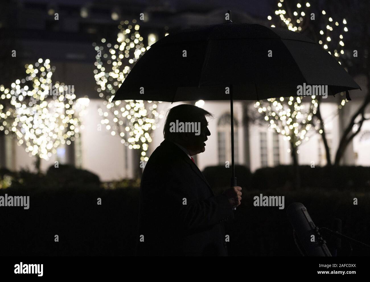 Washington, United States Of America. 10th Dec, 2019. President Donald J. Trump talks to members of the press on the South Lawn of the White House Tuesday, Dec. 10, 2019, prior to boarding Marine One to begin his trip to Hershey, Pa. People: President Donald J. Trump Credit: Storms Media Group/Alamy Live News Stock Photo
