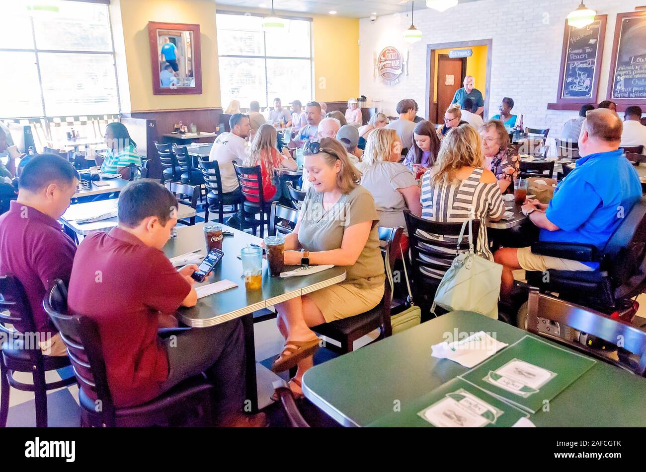 Customers eat in the dining room at Metro Diner, July 29, 2018, in Huntsville, Alabama. Stock Photo