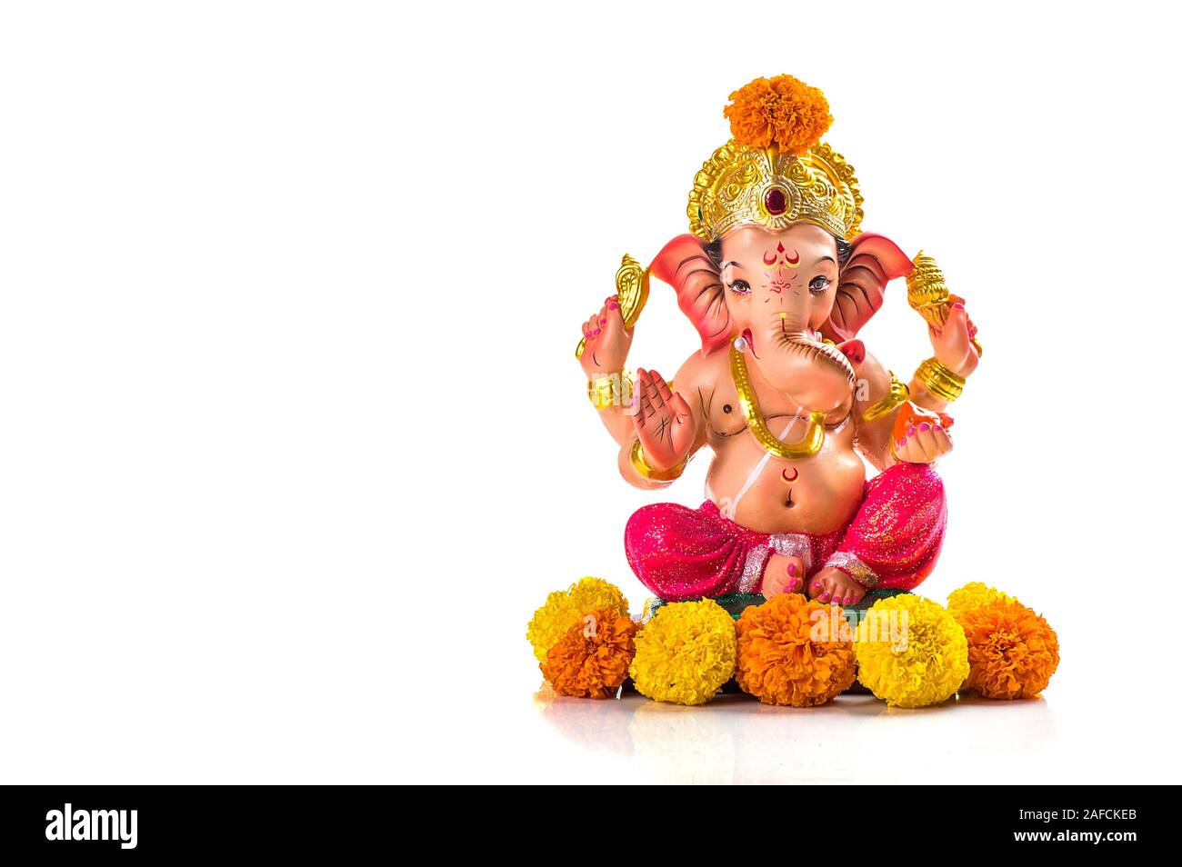 Hindu God Ganesha. Ganesha Idol on white Background Stock Photo - Alamy