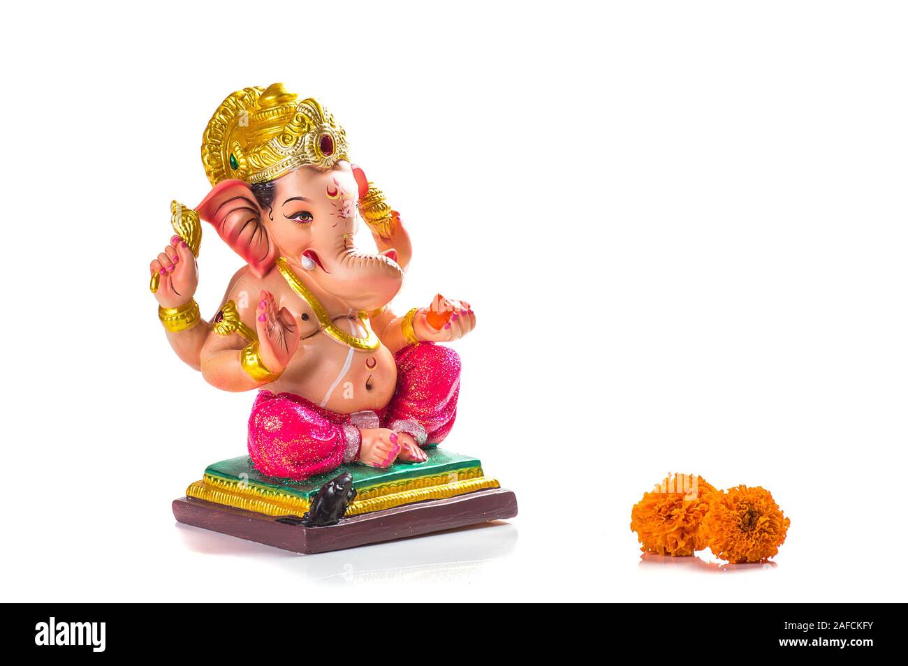 Hindu God Ganesha. Ganesha Idol on white Background Stock Photo ...