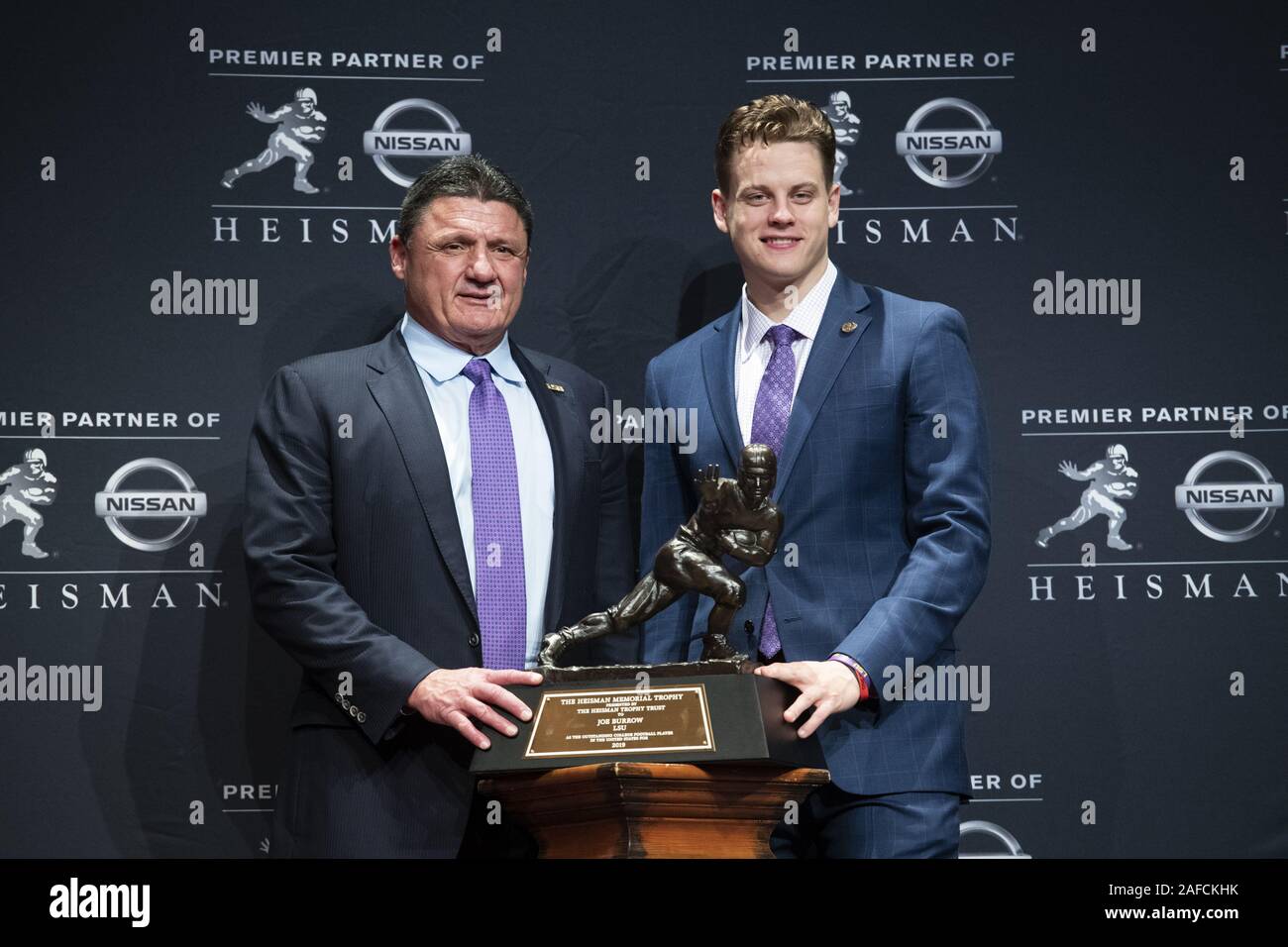 New York, United States. 14th Dec, 2019. LSU quarterback Joe Burrow, right, and head coach Ed Orgeron pose for a photo after Burrow wins the 2019 Heisman Trophy Award at the Marriott Marquis in New York City on Saturday, December 14, 2019. The other three finalists for the trophy were Ohio State quarterback Justin Fields, Oklahoma quarterback Jalen Hurts and Ohio State defensive end Chase Young. Photo by Corey Sipkin/UPI Credit: UPI/Alamy Live News Stock Photo
