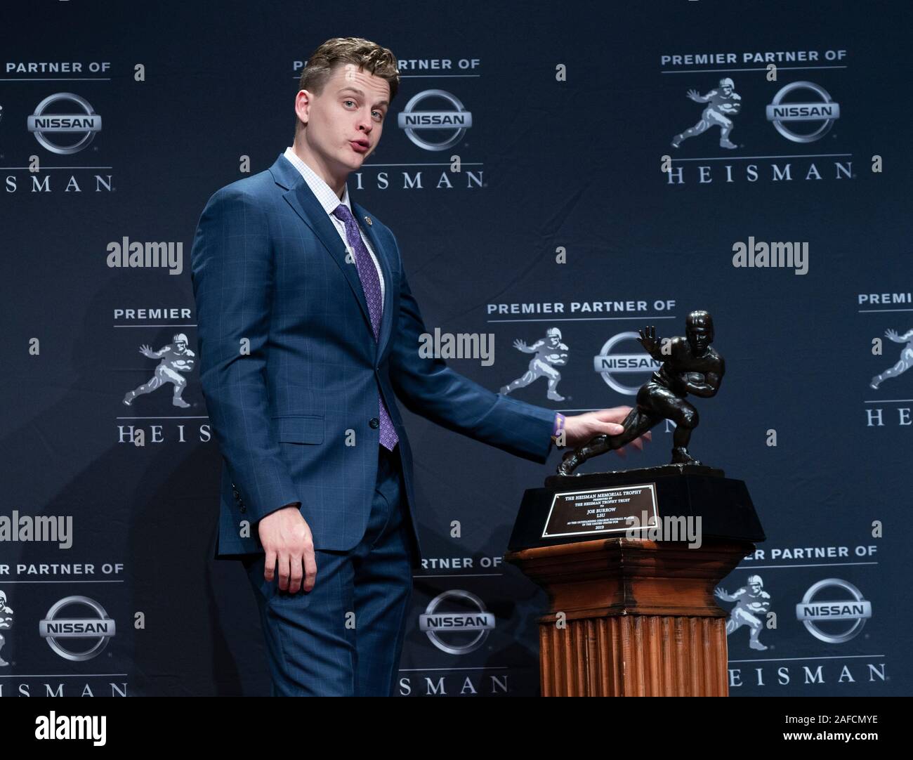 New York, NY - December 14, 2019: Quarterback Joe Burrow of the LSU Tigers winner of the 85th annual Heisman Memorial Trophy poses with trophy at the Marriott Marquis Hotel Stock Photo