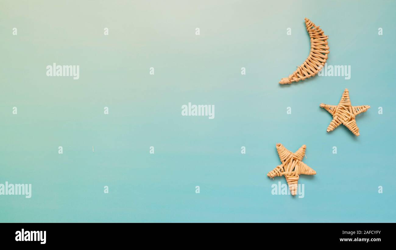 Woven crescent moon and stars on a blue background Stock Photo - Alamy