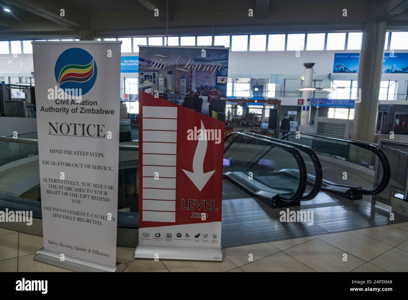 Harare, Zimbabwe. A notice in the Robert Gabriel Mugabe international airport, to note that the escalator is out of order. As of 2019, the country was in a financial crisis and even places as the airport are in decay and suffer from lack of funds. Stock Photo