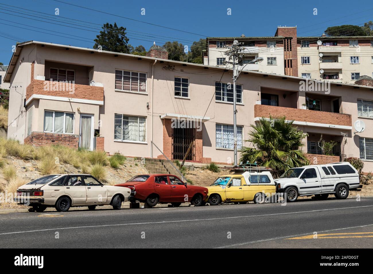 Living in Homes in Cape Town, South Africa. Cars, apartment blocks and