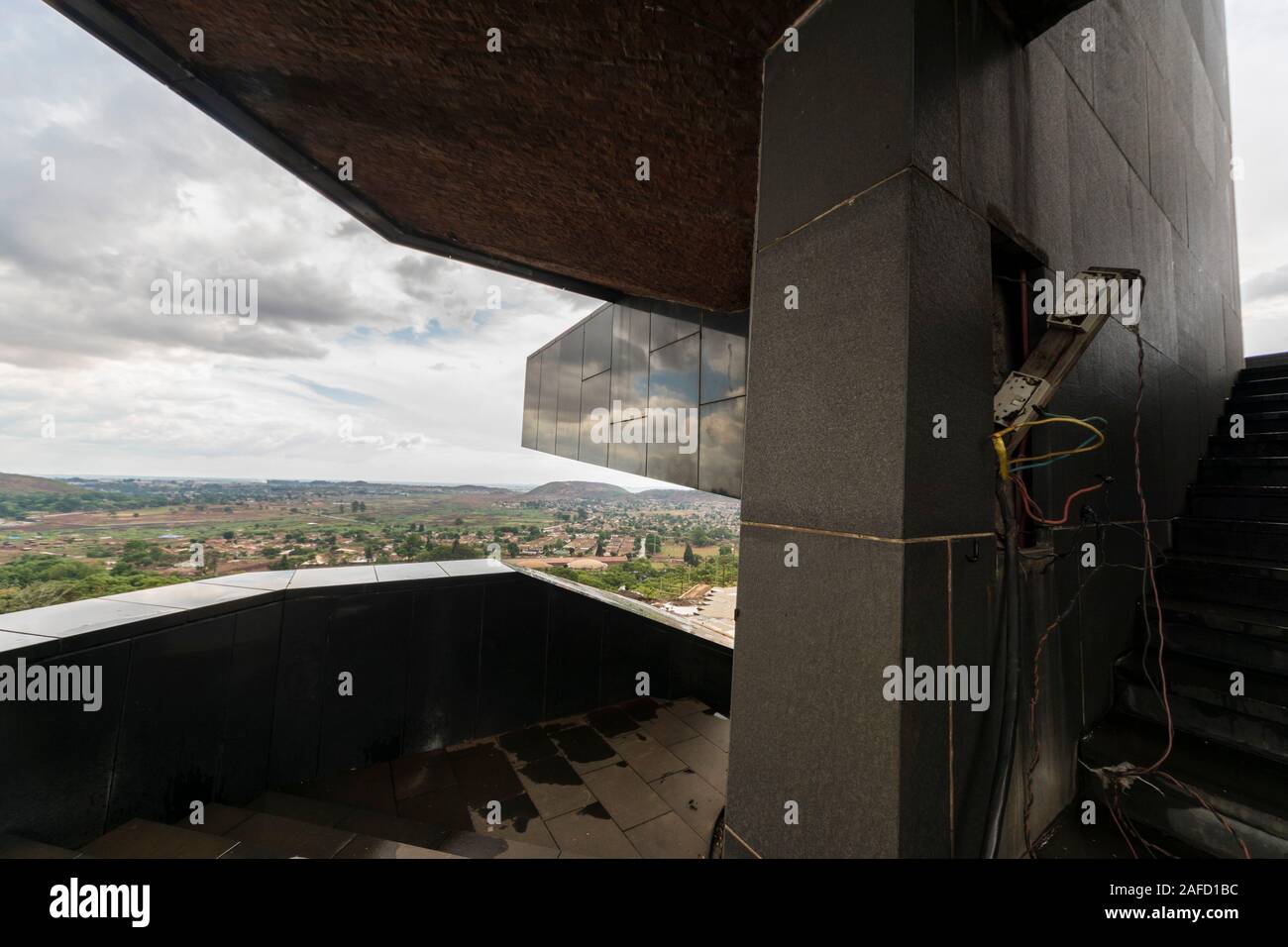 An exposed broken elecrical panel on the monument in the Zimbabwe's national heroes acre in Harare, the country's capital, serves as a sign of the country's situation and its financial problems. The city of Harare can be seen in the background. Novmeber 2019. Stock Photo