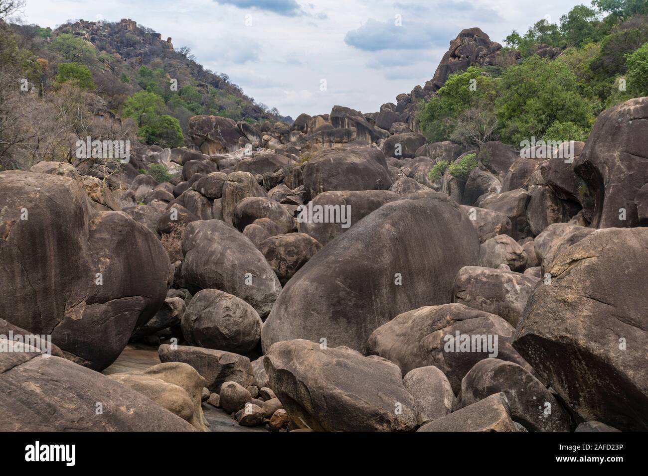 Matobo national Park, zimbabwe. Large stone mounds with a Kopje (Local term for a granite hill) in the background. Stock Photo