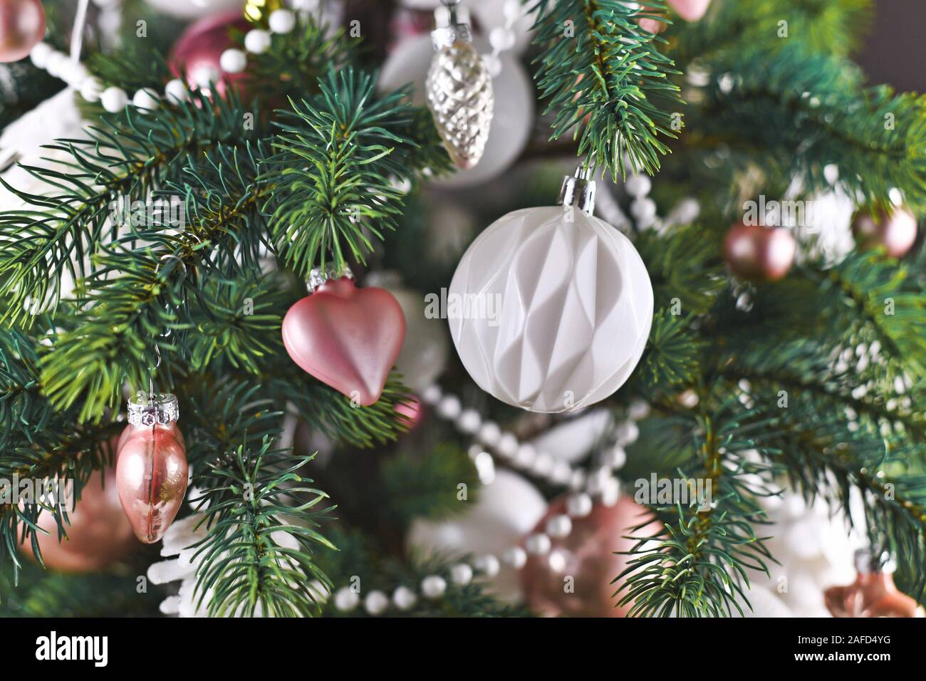 Close up of decorated Christmas tree with pink and white tree ornaments  like baubles, stars and pearl garland Stock Photo - Alamy