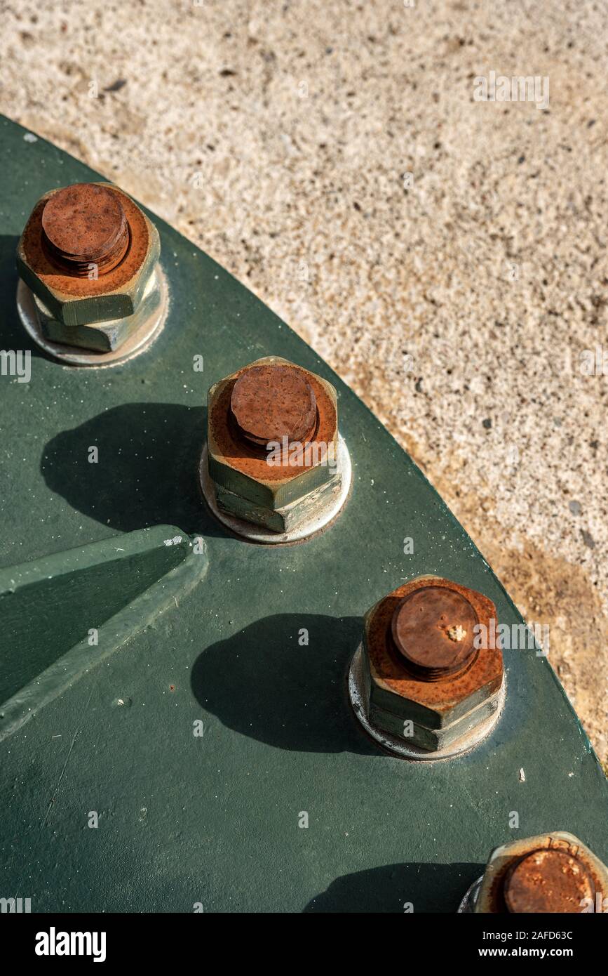 Close-up of rusty bolts with nuts and screws, metal corrosion concept Stock Photo