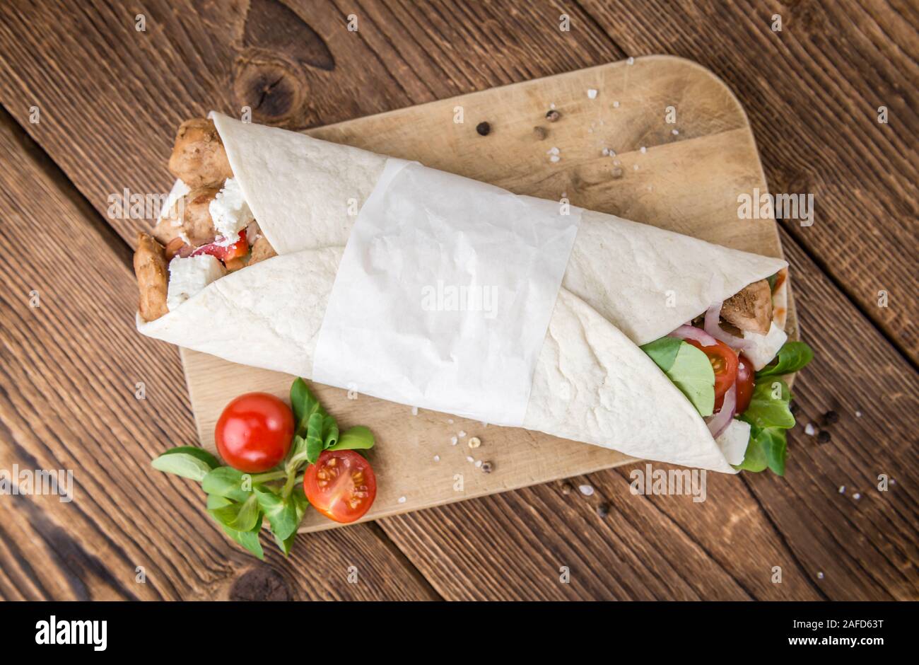 Homemade Chicken Wrap (close-up shot) on vintage background (selective focus) Stock Photo