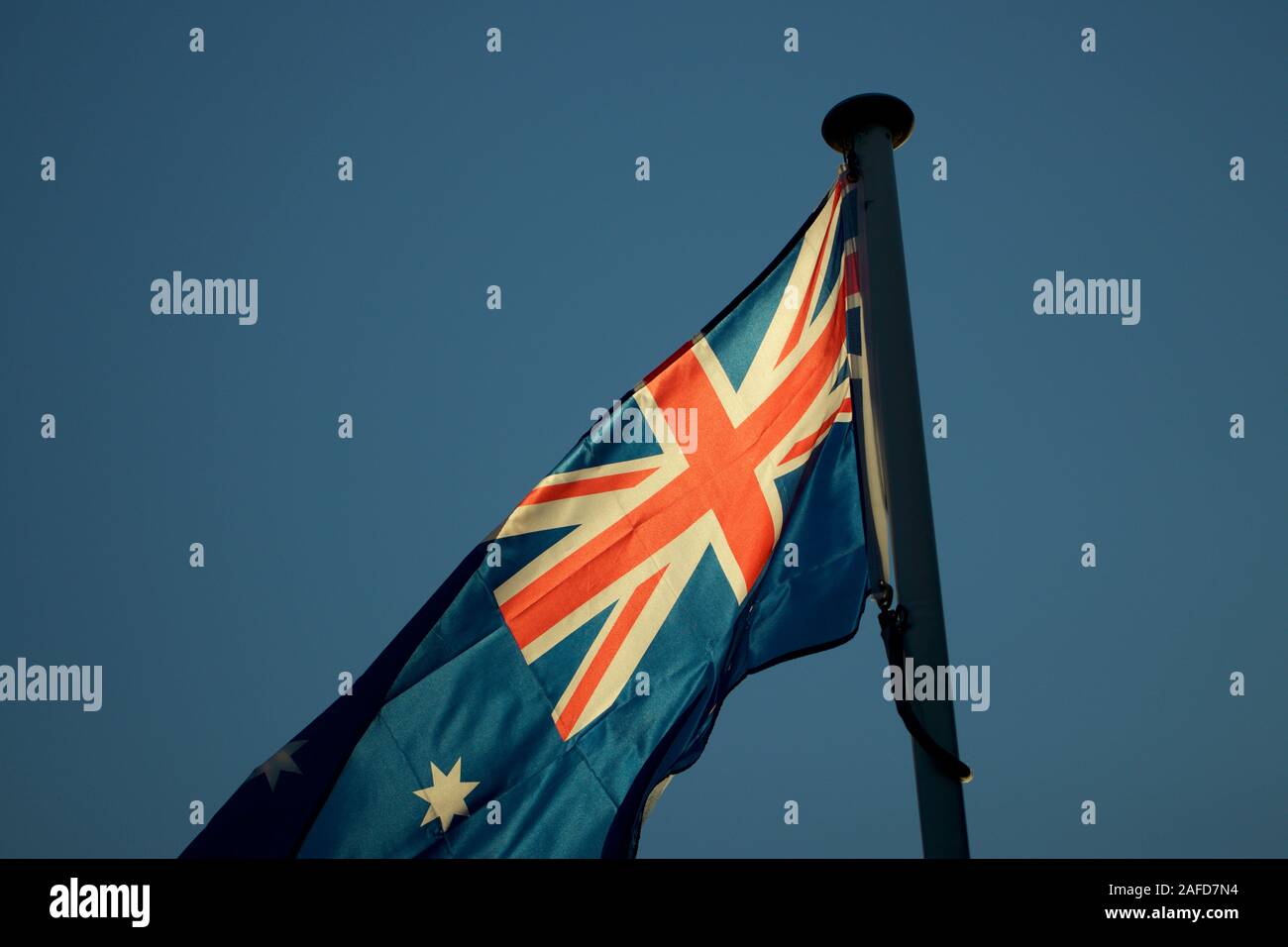 Flying the australian national flag hires stock photography and images