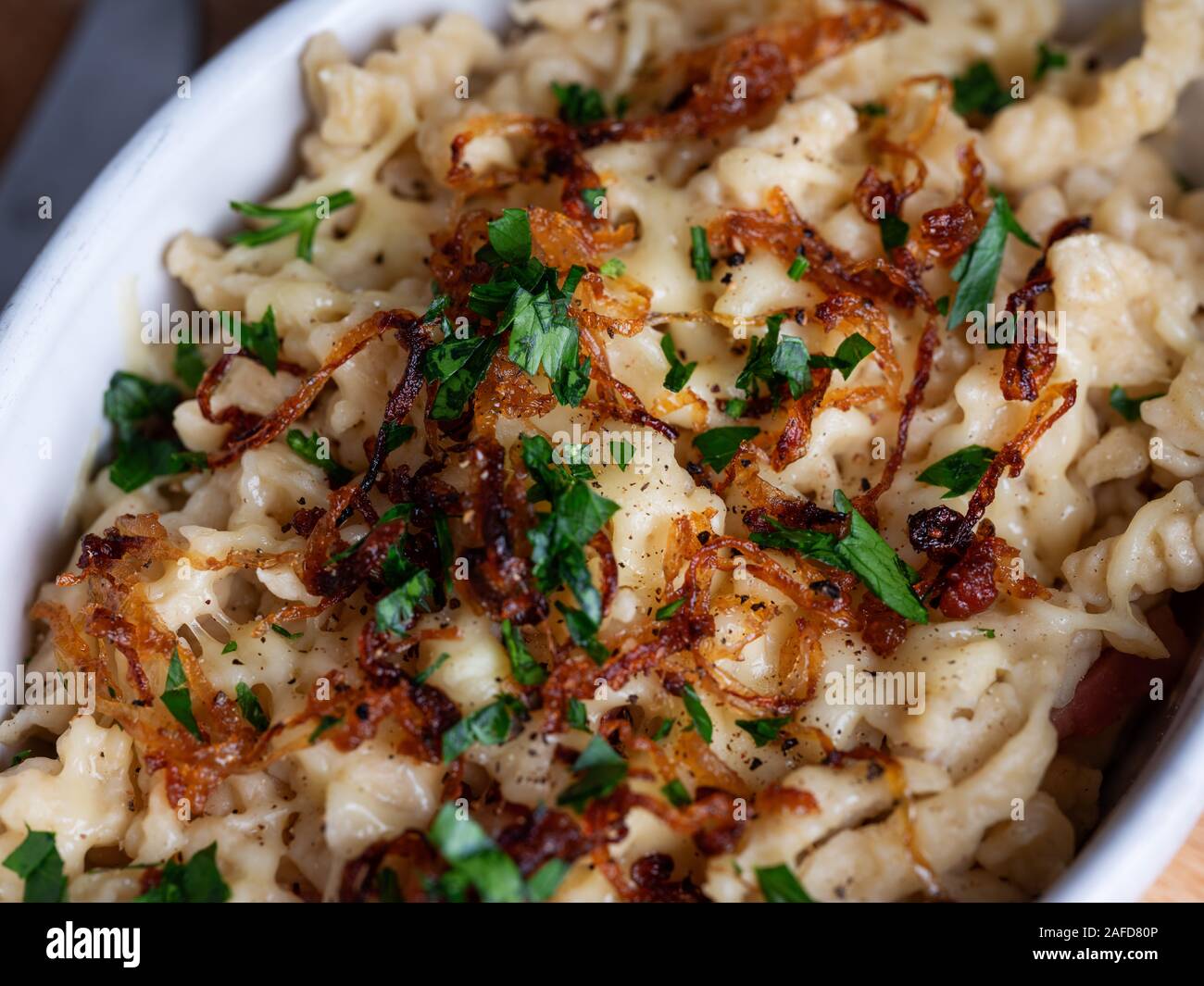 Kaesespaetzle, German cheese noodles with roasted onion Stock Photo Alamy
