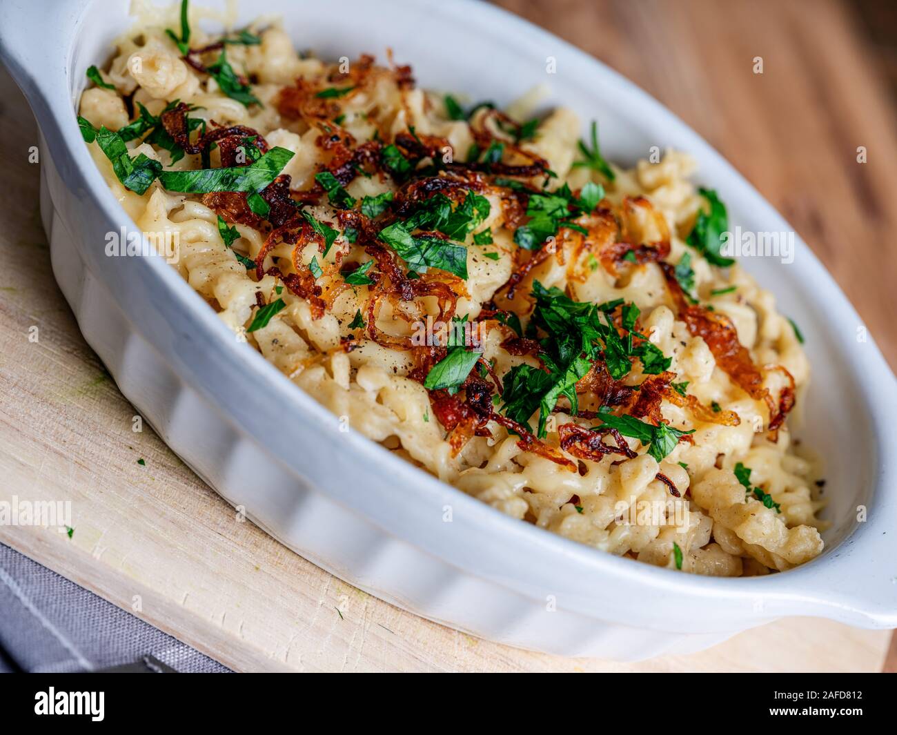 Kaesespaetzle, German cheese noodles with roasted onion Stock Photo Alamy