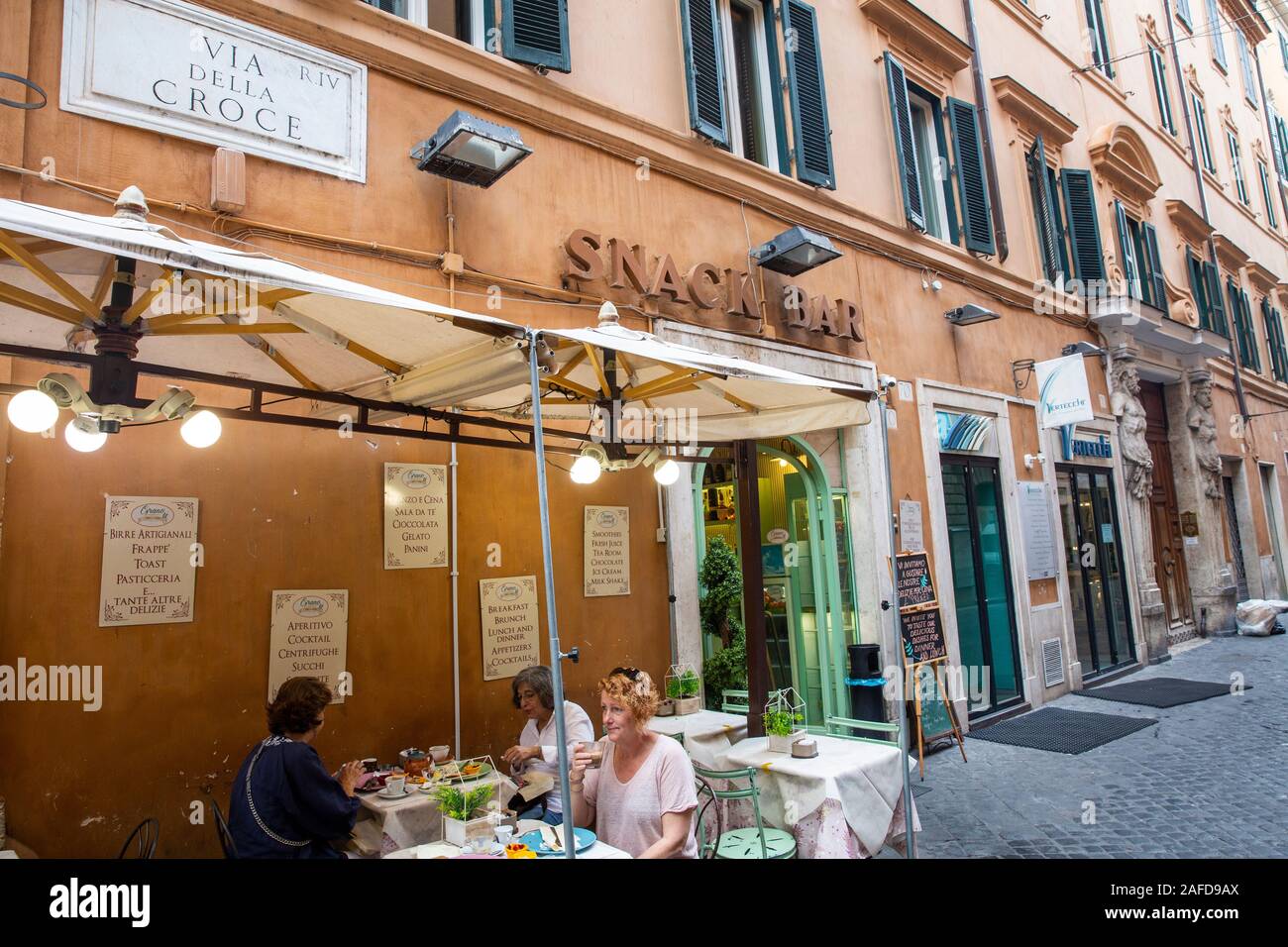 Rome snack bar Italy, women eating at a snack bar cafe in Rome city centre,Lazio,Italy,Europe Stock Photo