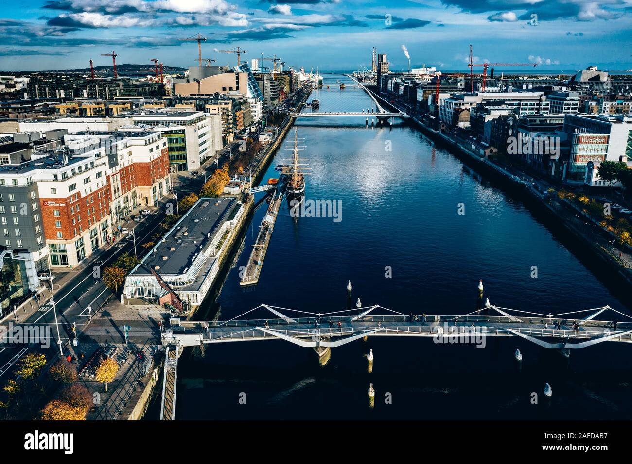 Aerial Dublin city view over Liffey River .Samuel Beckt and Sean O' Casey Bridge Stock Photo