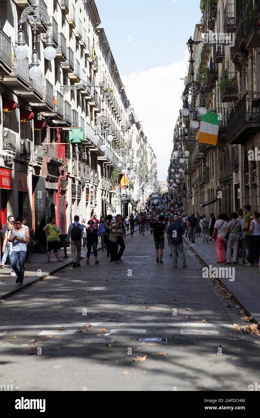 One of many side-streets in Barcelona thronging with tourists and Catalan people. Stock Photo