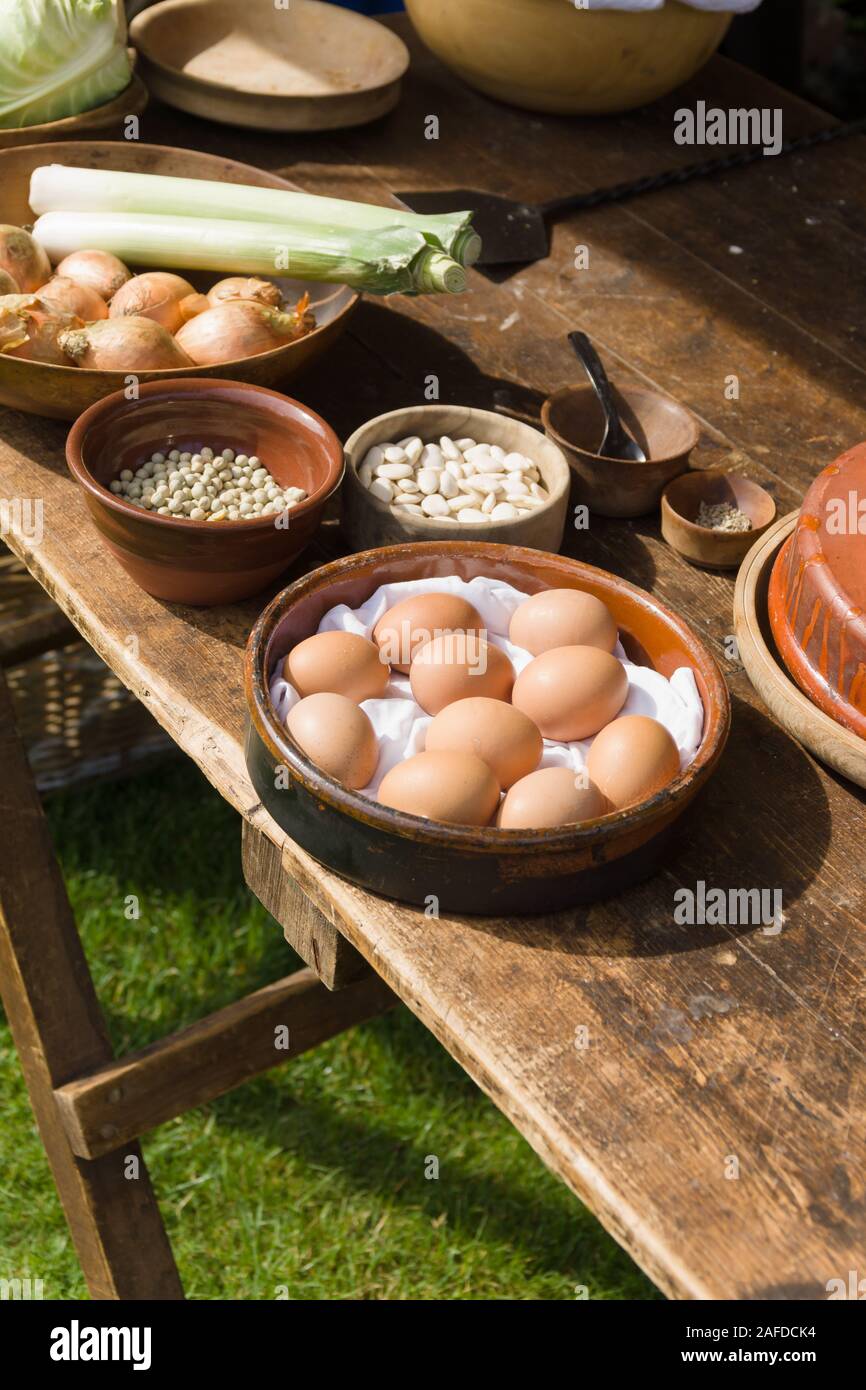 Typical selection of Medieval food including eggs, beans, onions and leeks the kinds of food eaten by peasants and poorer people Stock Photo