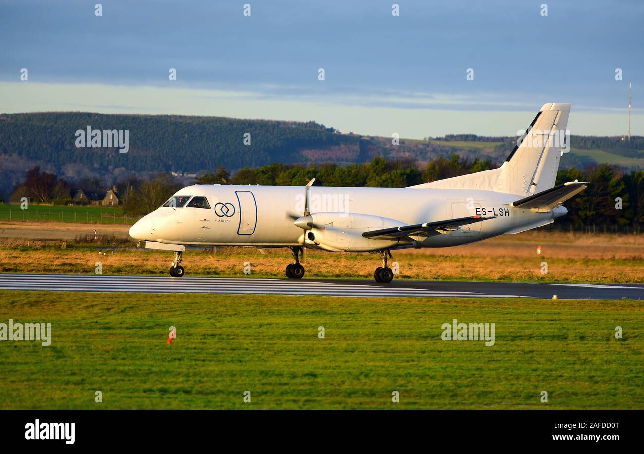 Swedish built Saab 340 AF twin engined turboprop cargo aircraft arriving at Inverness airport in the Scottish Highlands in the UK. Stock Photo