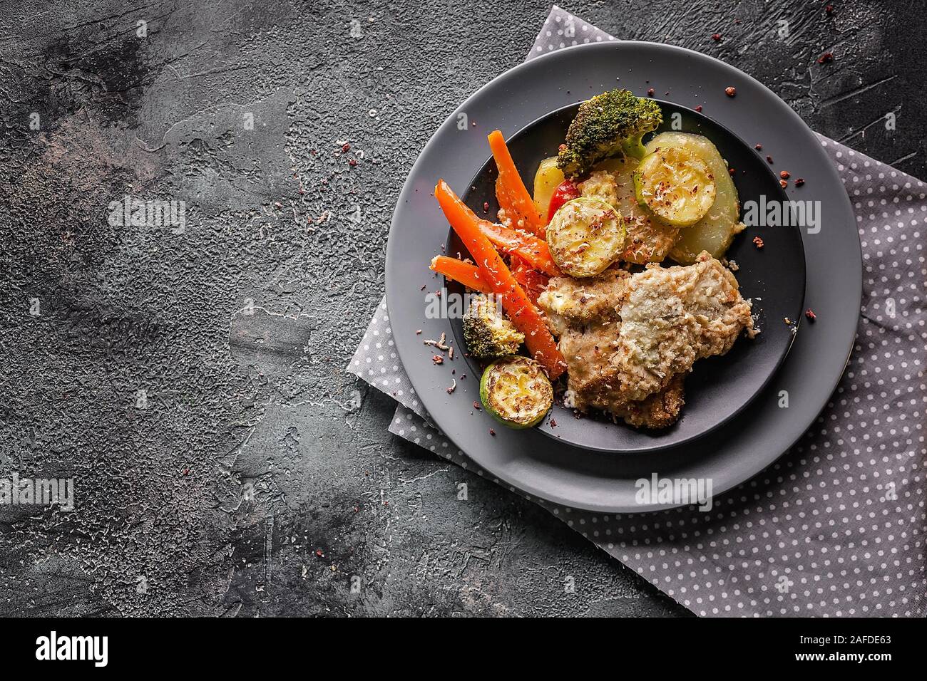 Top view cod with baked vegetables. Healthy and tasty food. Traditional ...