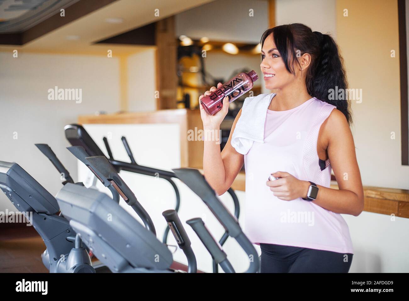 Fitness girl workout in the gym. Exercises for women, bodybuilder train
