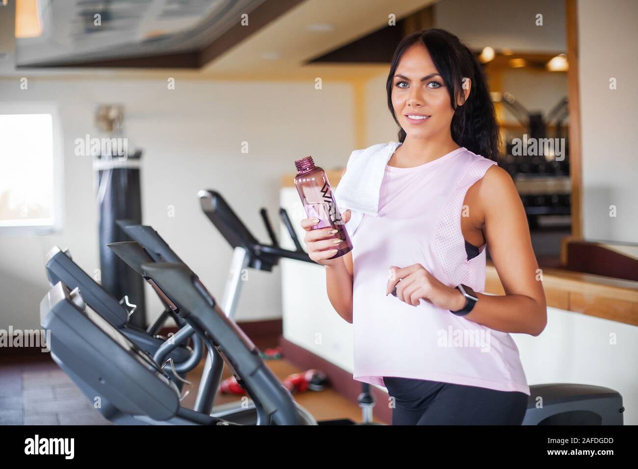 Fitness girl workout in the gym. Exercises for women, bodybuilder train