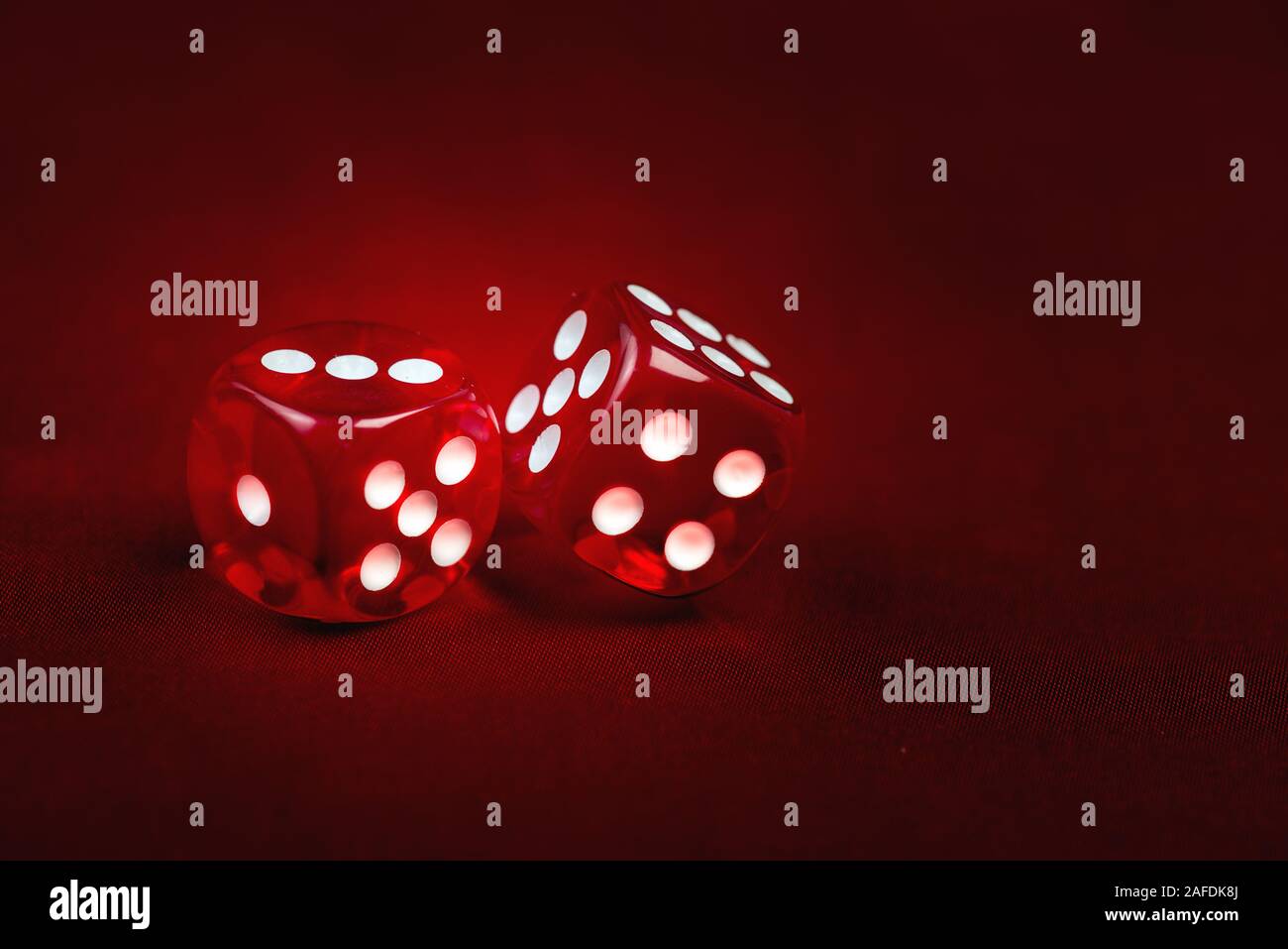 Two dices on gradient red background. Risk concept Stock Photo