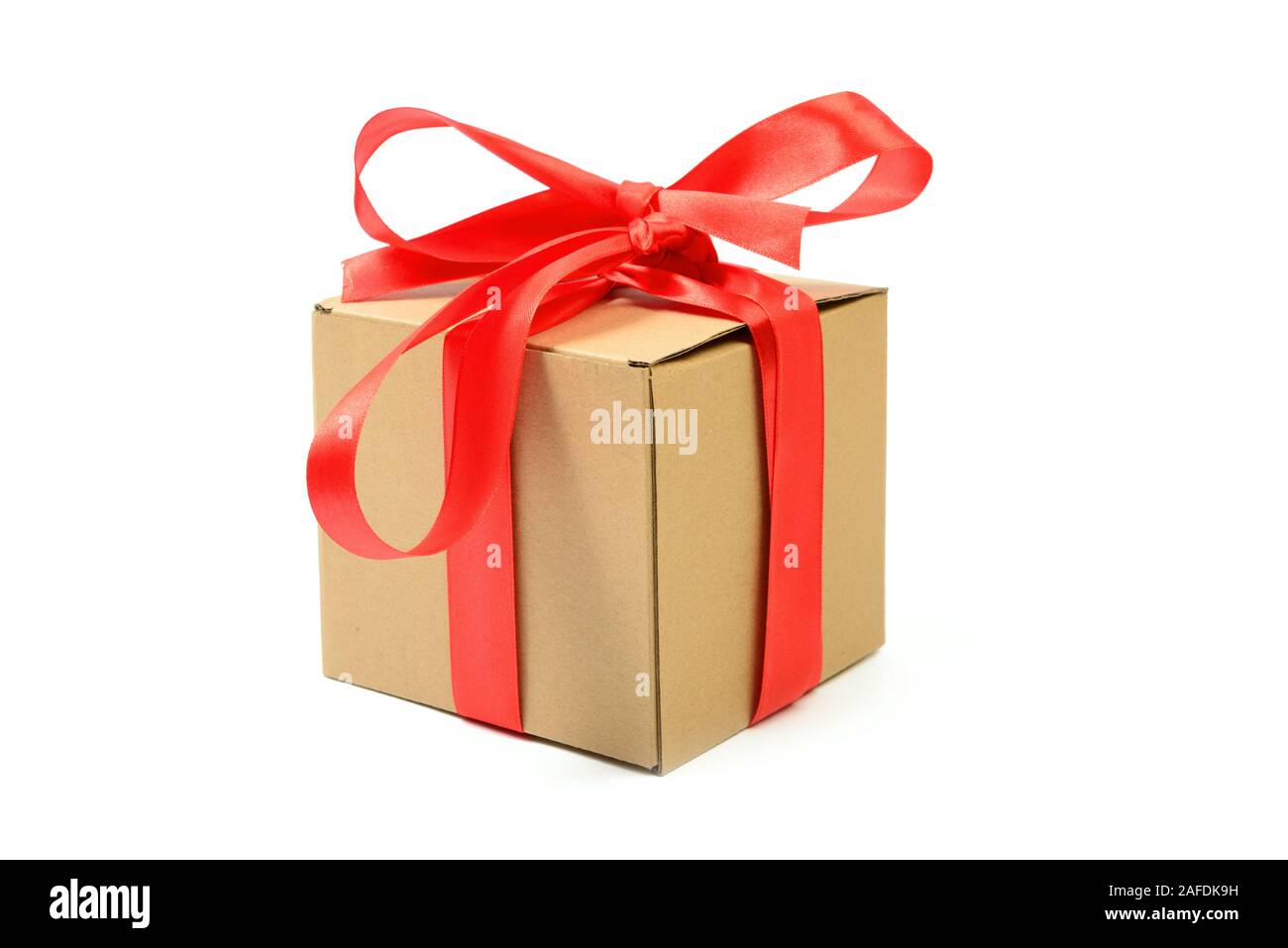 Cardboard gift box with red ribbon bow isolated on white Stock Photo